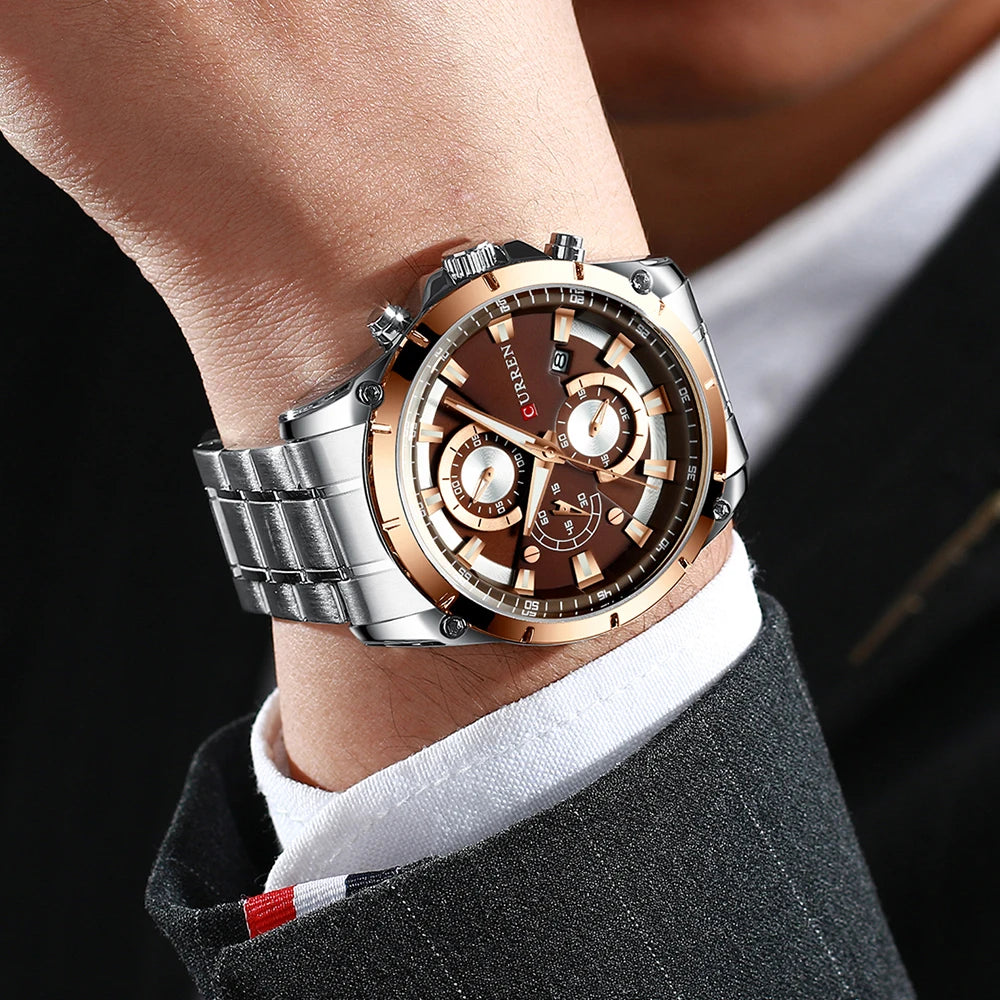 Men's luxury watch with a silver stainless steel strap, brown face, gold-tone bezel, and chronograph dials.