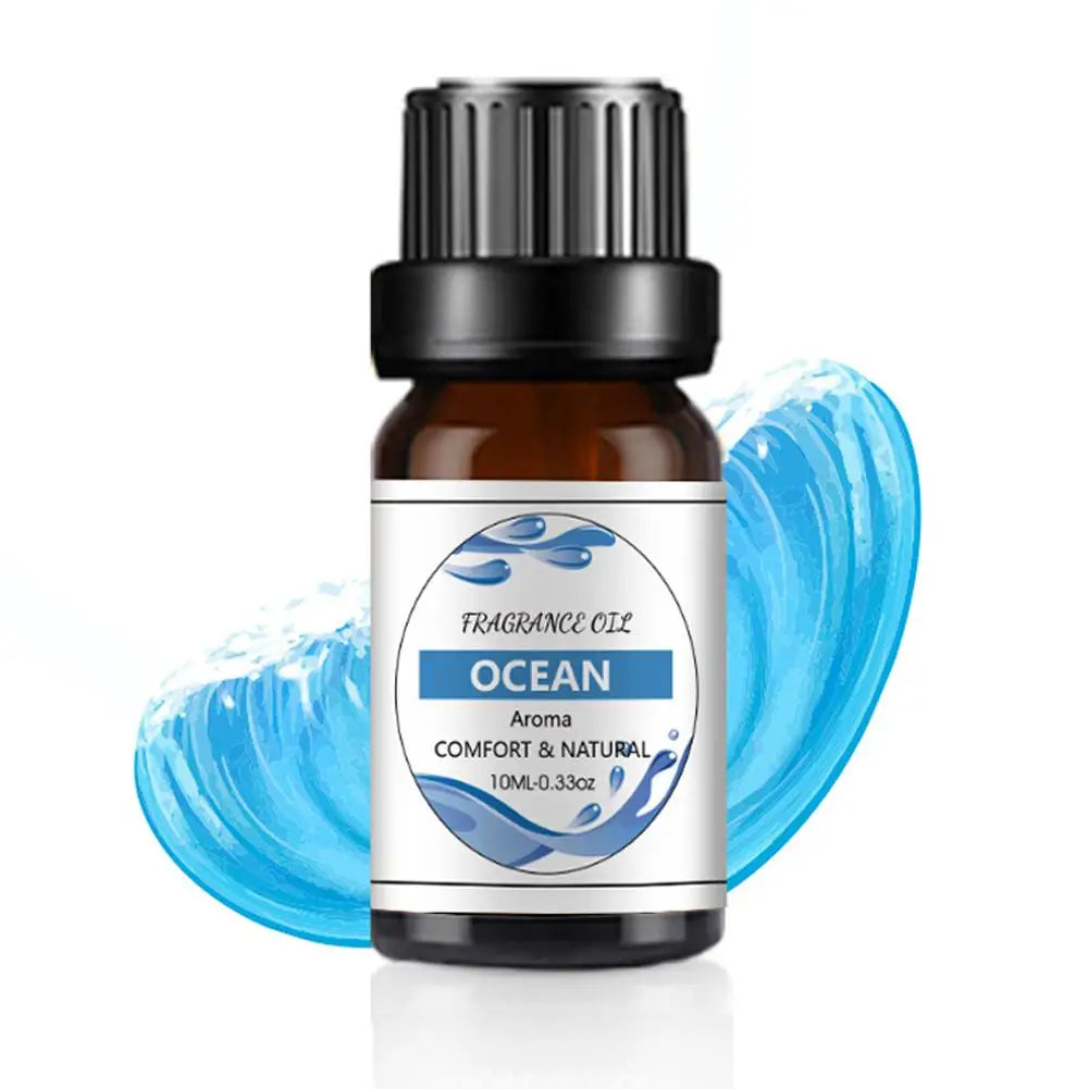 10ml amber glass bottle of Ocean fragrance oil with a black dropper cap, set against a graphic blue wave background.