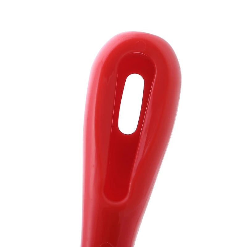Close-up of a smooth, glossy red plastic handle with a vertical hanging hole for easy storage.