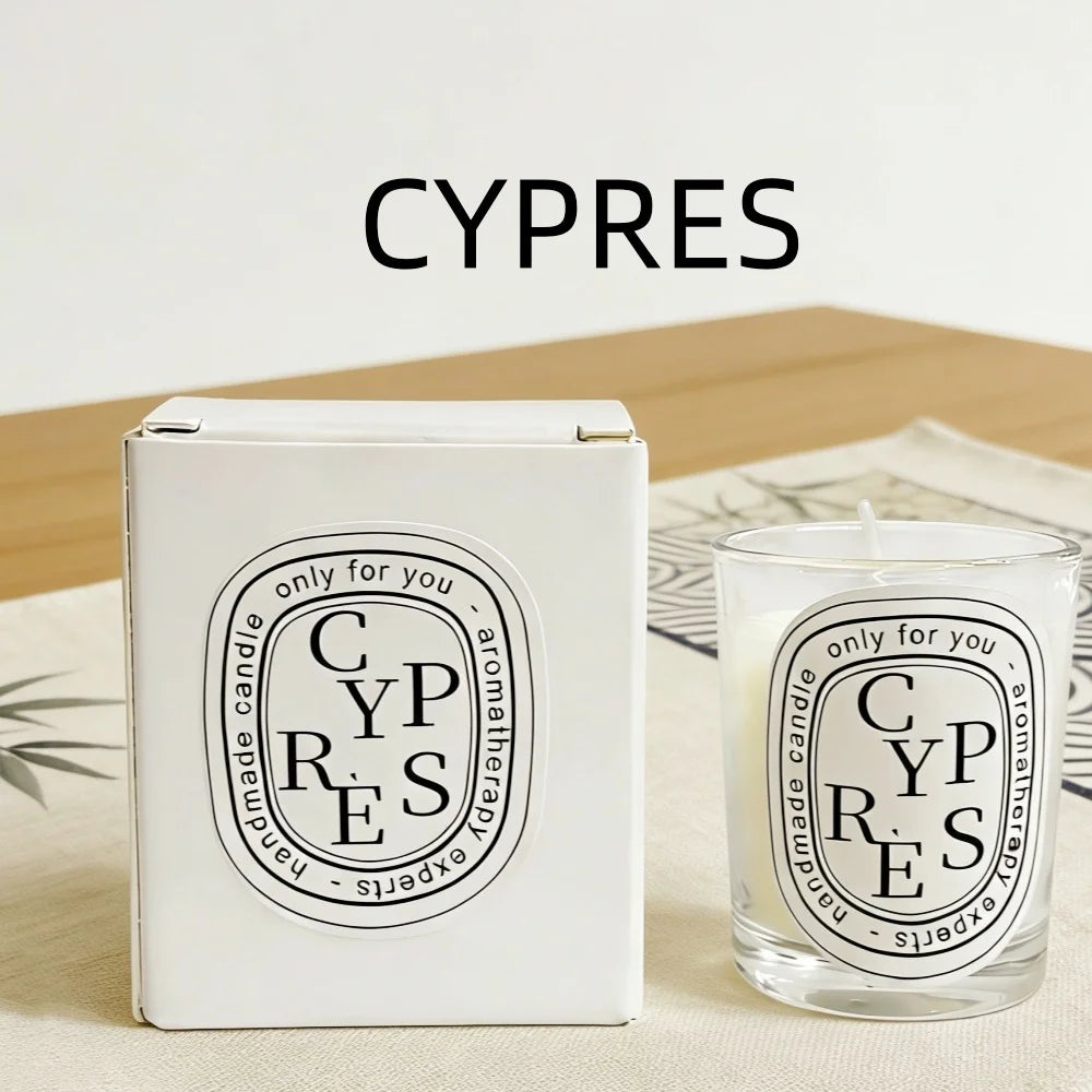 White handmade aromatherapy candle in a glass jar, paired with a matching white box, both featuring oval "CYPRES" labels.