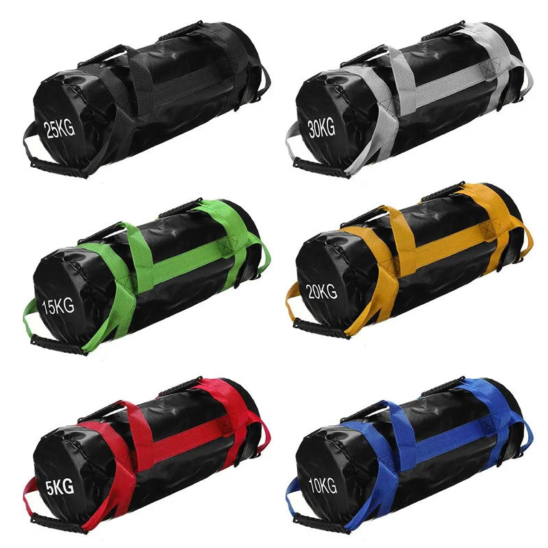 Six black cylindrical fitness sandbags with straps in black, grey, green, yellow, red, and blue, marked 5kg to 30kg.
