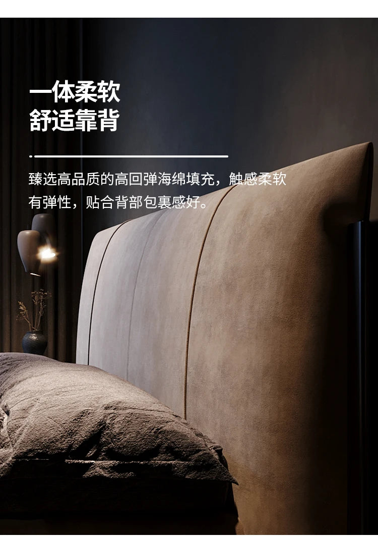 A plush, taupe upholstered bed headboard with vertical panel stitching in a soft-touch, modern minimalist style.