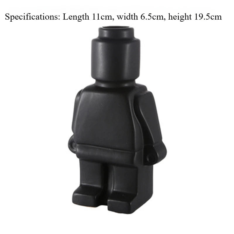 Matte black ceramic vase shaped like a toy figure, 19.5cm tall. Modern minimalist home decor piece.