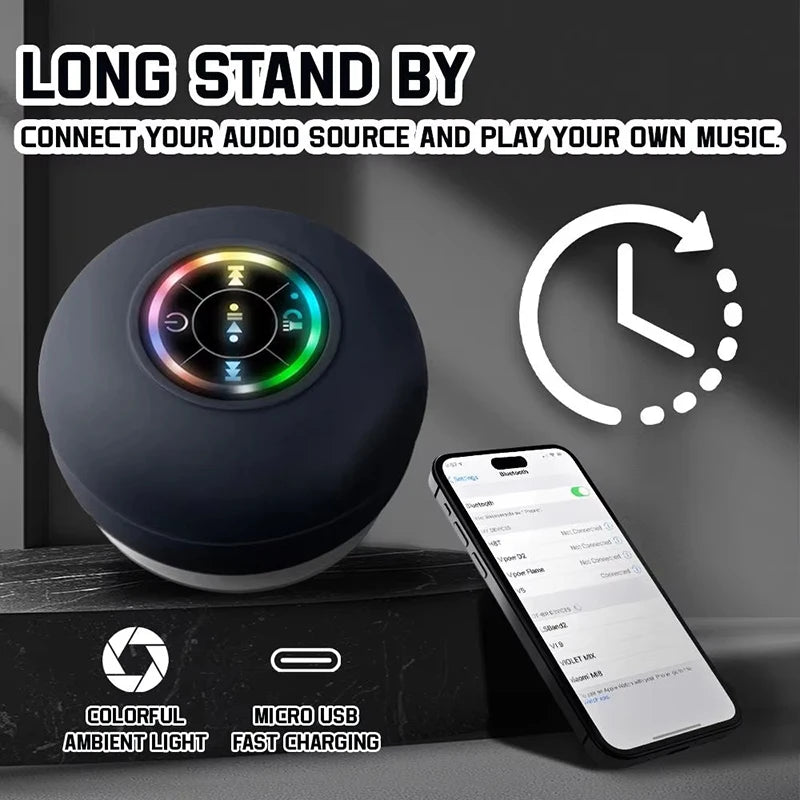 A portable black wireless shower speaker with multicolour LED light ring, playback controls and USB charging port.