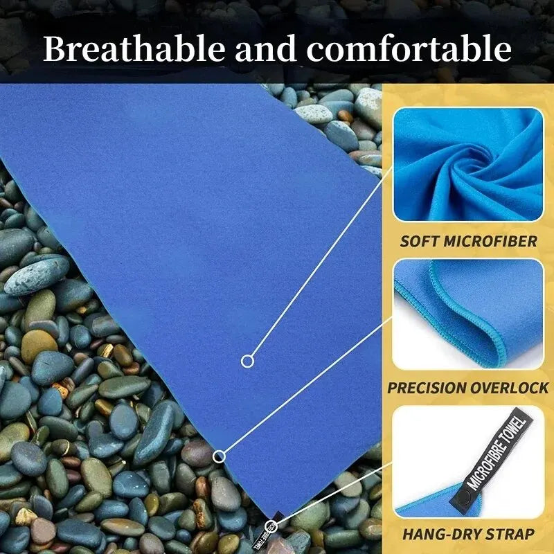 Blue microfiber towel showing soft texture, stitched overlock edges, and a hang-dry strap.