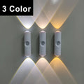 Three slim, white, motion-sensor wall lights glowing with cool white, neutral, and warm light settings.