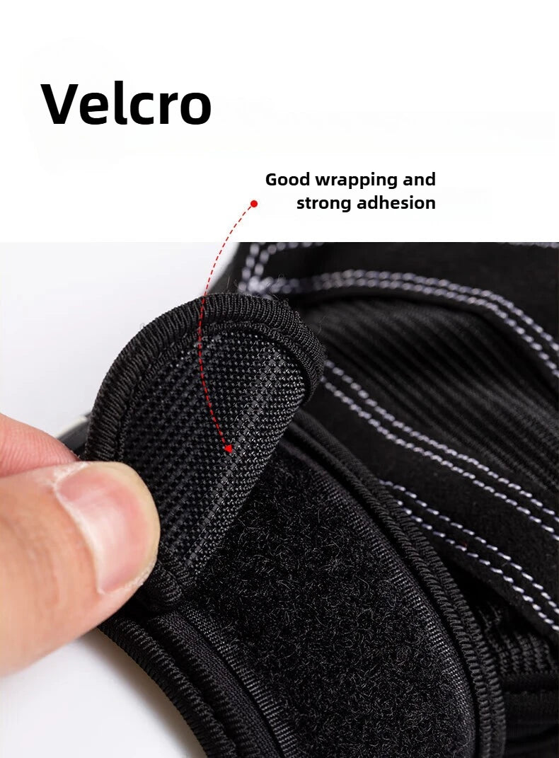 Close-up of a black adjustable support strap with textured Velcro fastenings and white reinforced stitching.