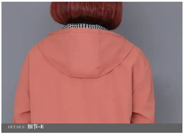 Back view of a dusty pink hooded jacket with a black and white gingham collar detail.