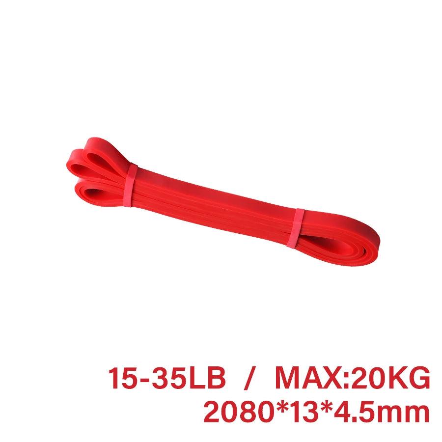 Red resistance band, looped for exercise, with text indicating 15-35lb / 20kg capacity and dimensions.