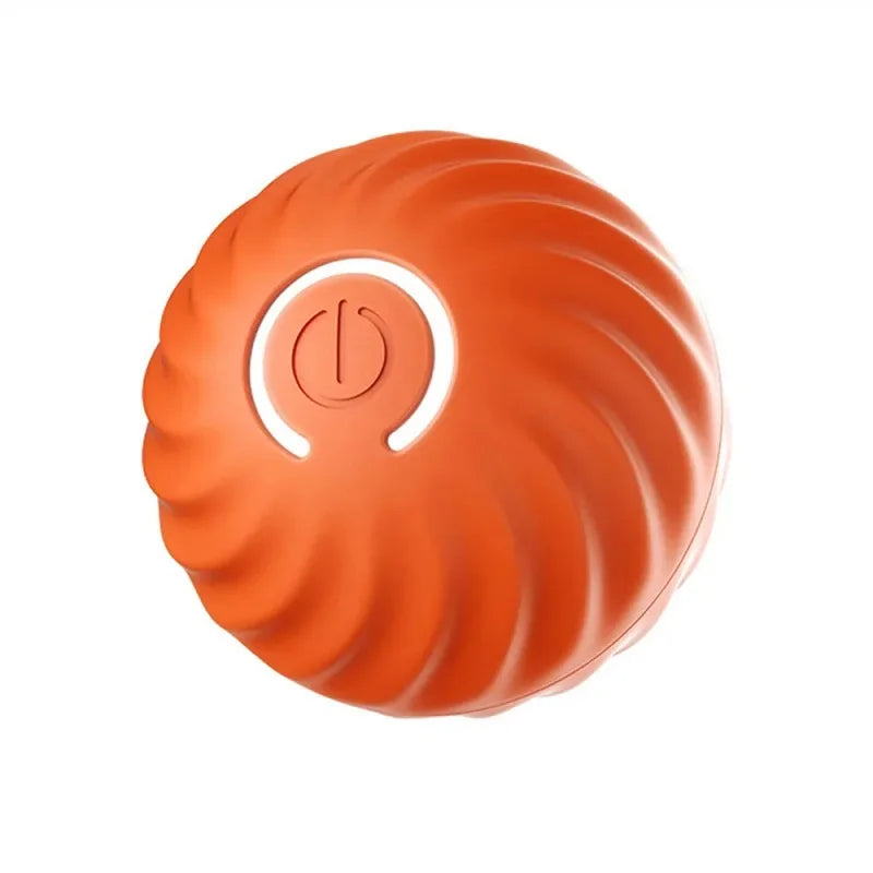 Orange interactive dog toy ball with a textured swirl design and a central power button.