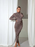 Taupe long-sleeved pleated maxi dress with a slim-fit silhouette, high neckline, and gathered ruching.