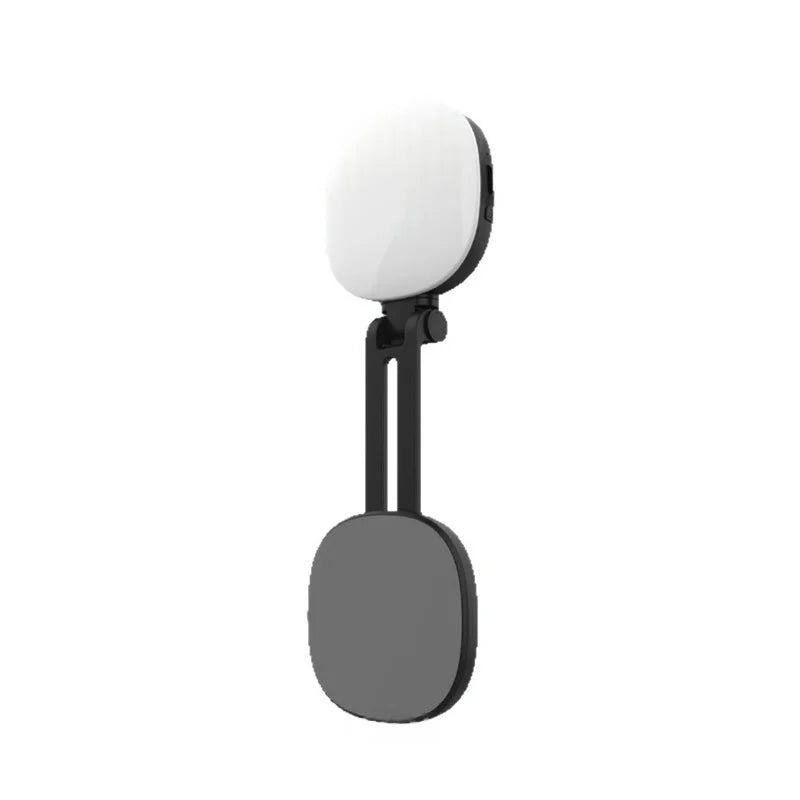 Portable LED ring light with a black adjustable folding stand, ideal for phone photography and video calls.