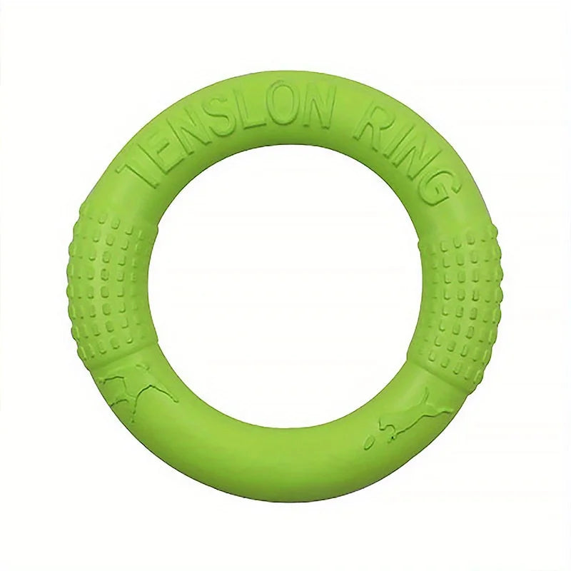 Bright green, circular EVA foam dog training ring with textured grip sections and embossed dog motifs.