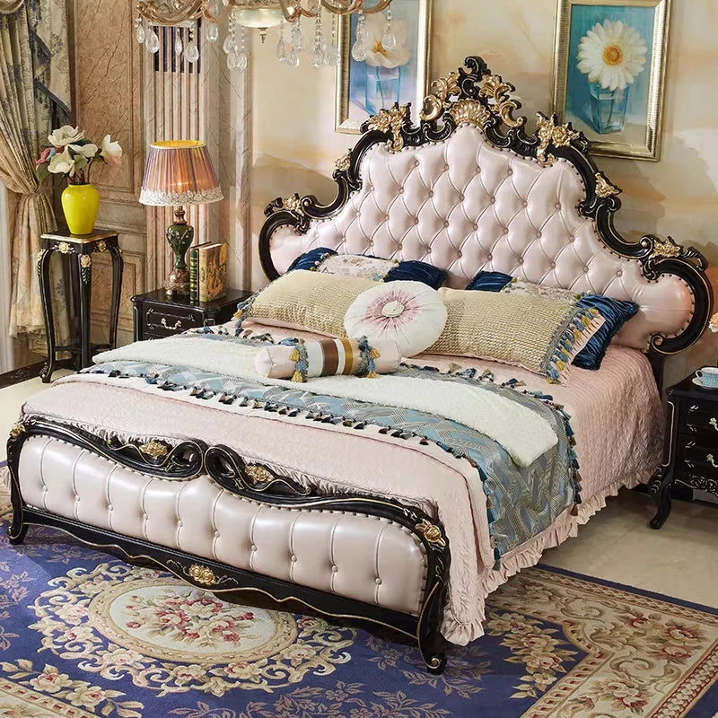 Ornate double bed with a button-tufted cream padded headboard, black wooden frame, and intricate gold detailing.