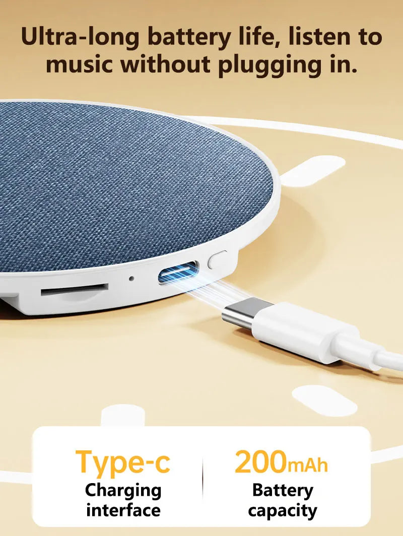 Round, blue fabric-covered wireless pillow speaker with a white frame and USB-C charging port.