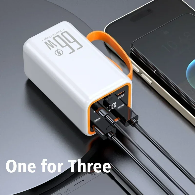 White portable power bank with orange strap, digital display, and three charging cables plugged in.