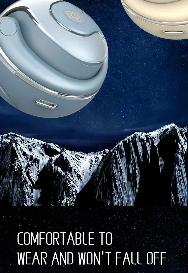 Blue and cream-colored spherical ear cuffs displayed over a snowy mountain landscape at night.