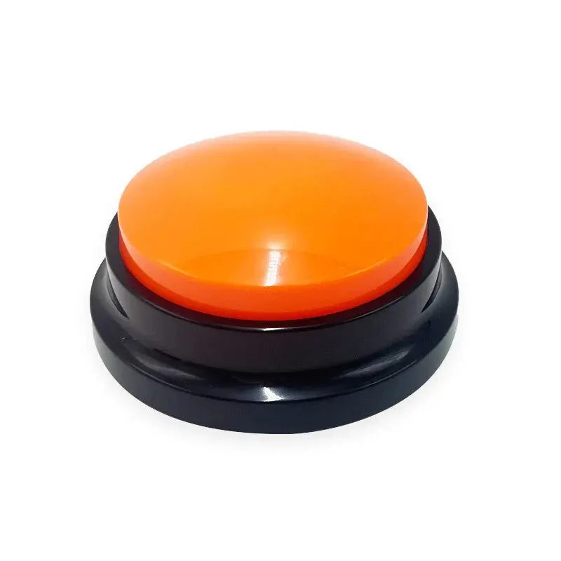 A round, interactive recordable dog training button with a bright orange top and a black circular base.