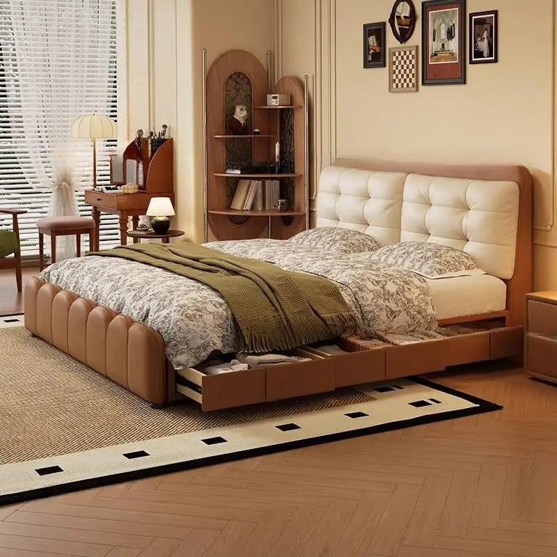 Modern tan leather platform bed with a tufted cream headboard and integrated side storage drawers in a bedroom setting.