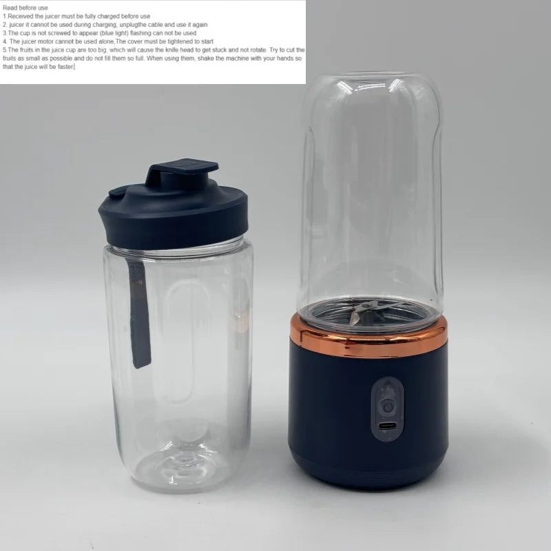 Portable electric juicer with a dark blue base, copper-tone trim, clear cup, and a matching dark blue travel lid.