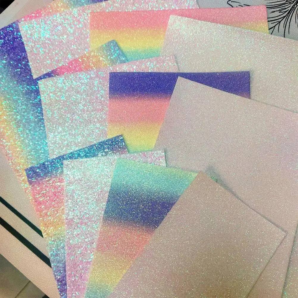 Assorted sheets of vibrant, iridescent glitter craft fabric in rainbow, pastel, and solid shimmery finishes.