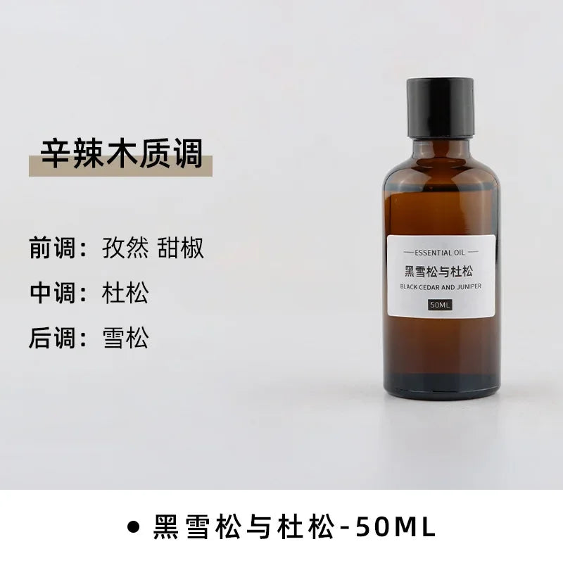 50ml bottle of Black Cedar and Juniper essential oil in an amber glass bottle with a black screw cap.