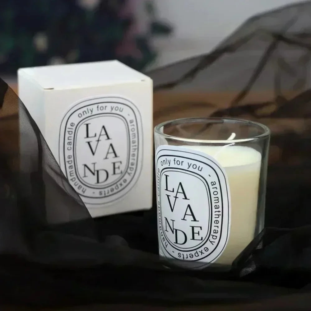 Aromatherapy lavender candle in a clear glass jar with matching white gift box, featuring elegant monochrome labeling.