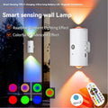 Minimalist white rechargeable LED wall lamp with motion sensor, RGB gradient light effects, and remote control.