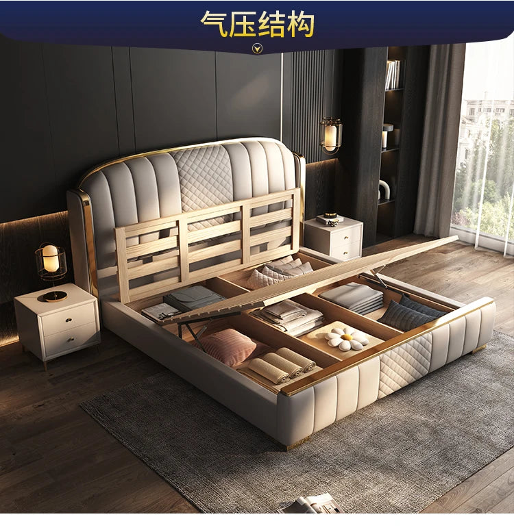Minimalist cream upholstered bed frame with gold accents and an open gas-lift storage base in a modern bedroom.
