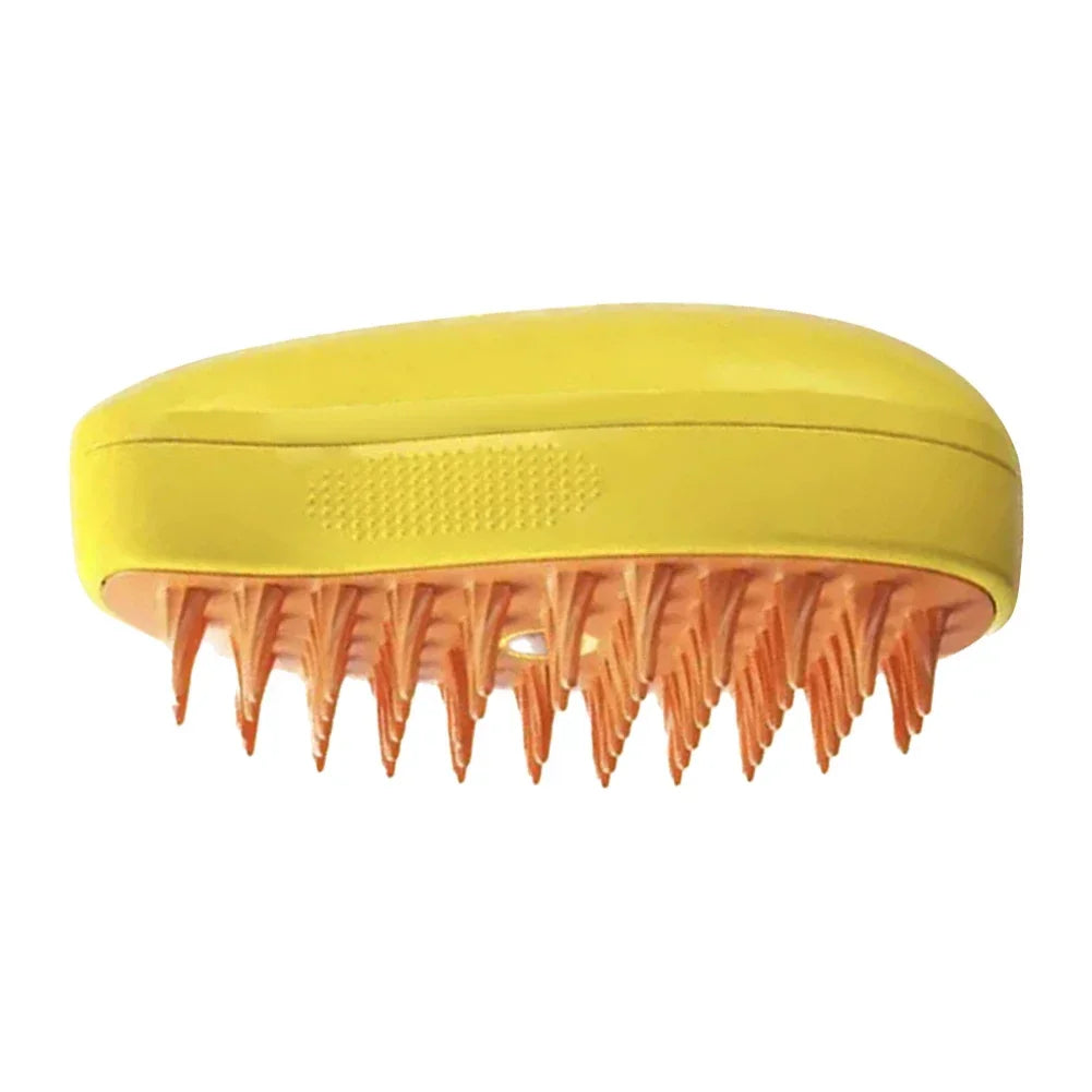 Yellow scalp massager brush with an orange base and flexible, pointed silicone bristles.