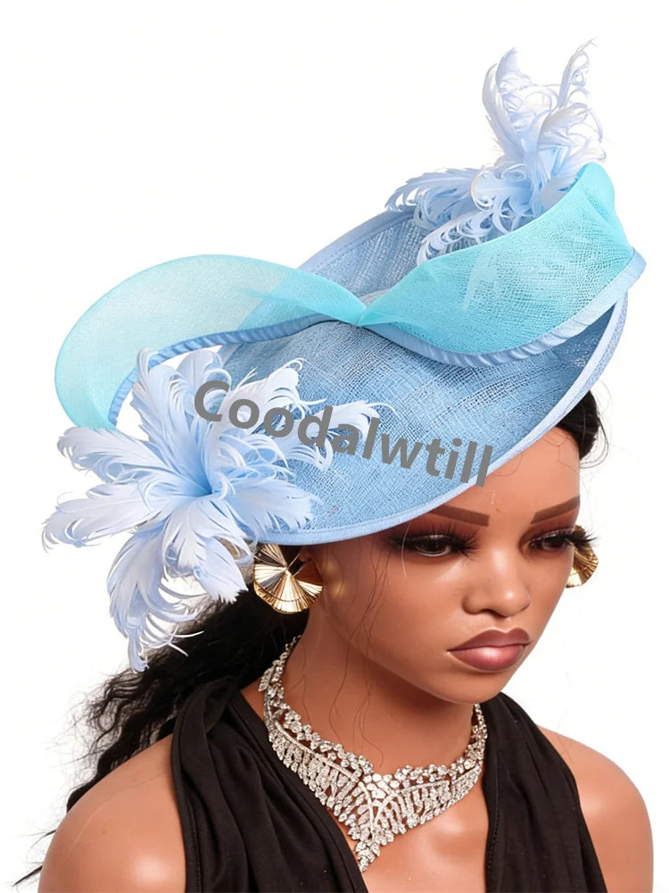 Elegant light blue saucer fascinator, featuring delicate feathers and a structured organza ribbon trim.