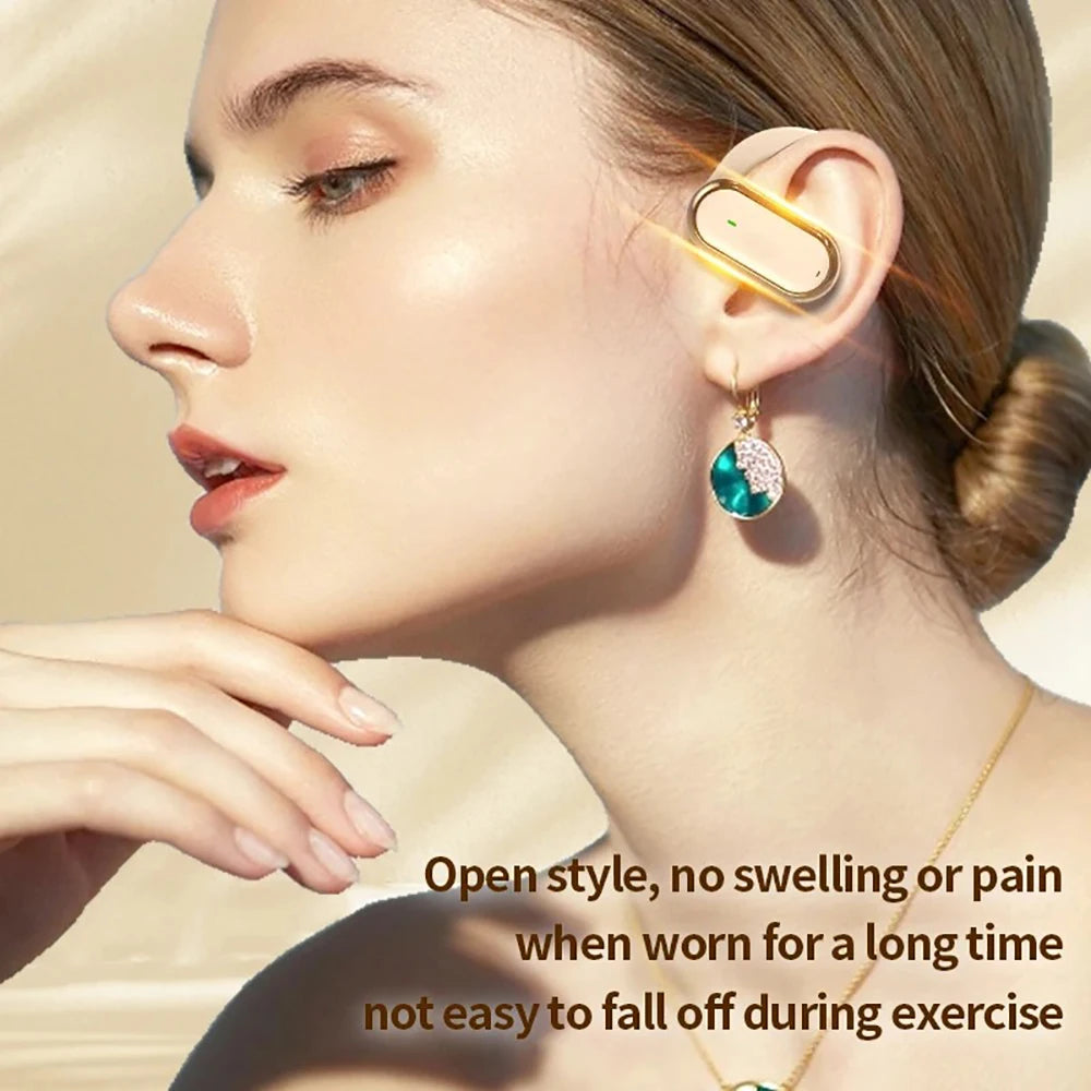 A woman wearing a sleek, gold-coloured open-ear wireless earbud that clips onto the outer ear.