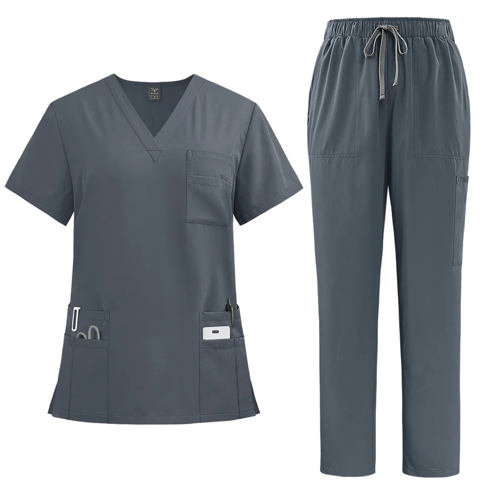 Charcoal grey women’s nurse scrub set, featuring a V-neck top with multiple pockets and drawstring trousers.