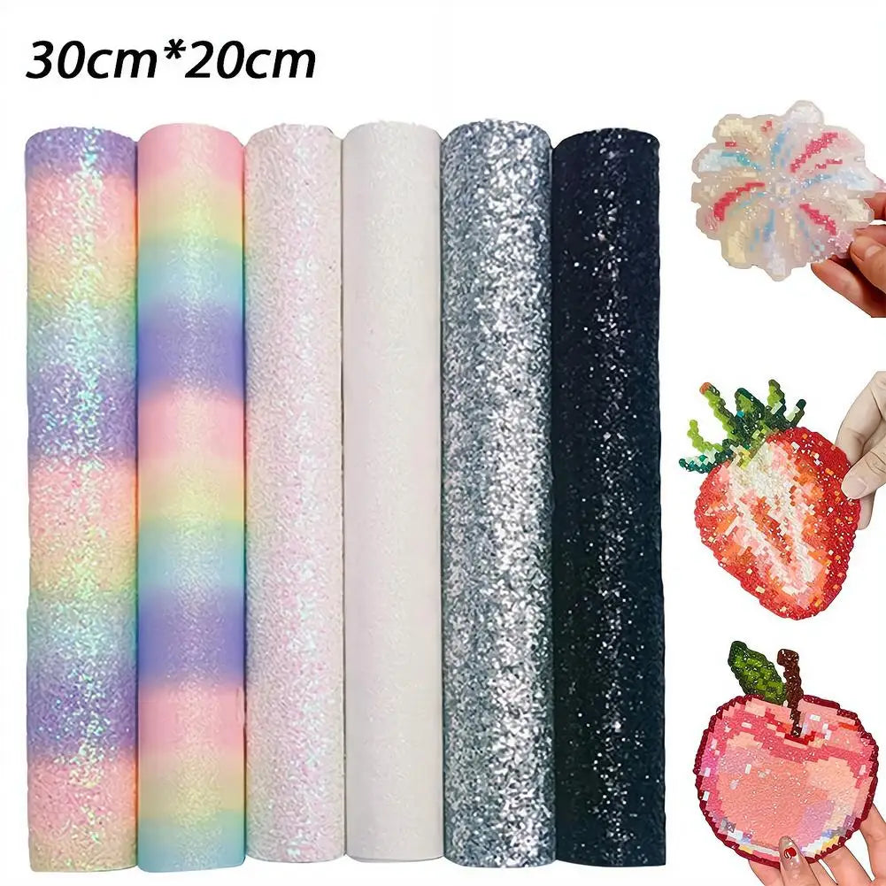 Six rolls of 30x20cm glitter and pastel craft fabric sheets in various textures, plus example cut-out shapes.
