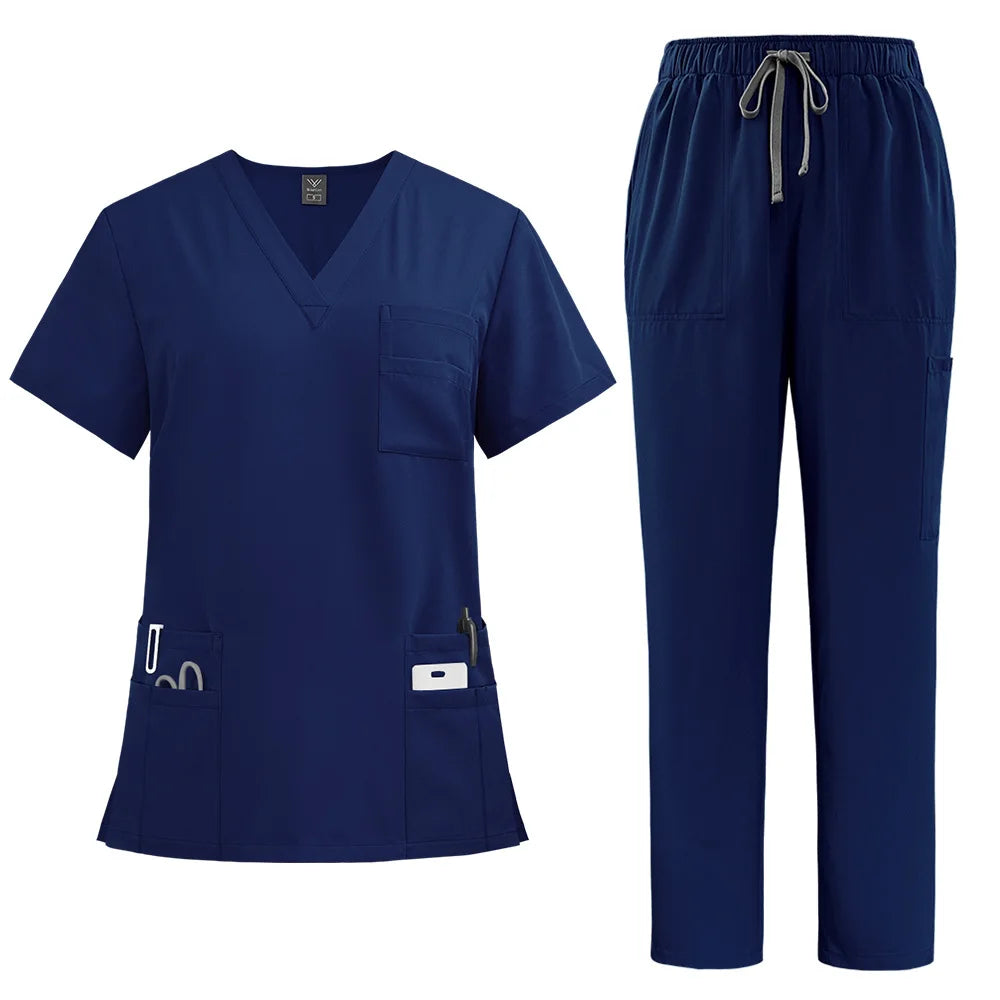 Navy blue women’s scrub set featuring a V-neck top with multiple pockets and matching trousers with a drawstring waist.