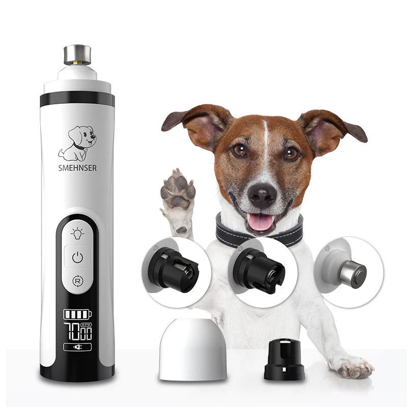 White, handheld electric pet nail grinder with LED light, digital display, and various grinding heads next to a dog.