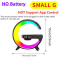 G-shaped black speaker with vibrant RGB LED light, integrated digital clock, and wireless charging base.