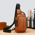 Tan brown faux leather crossbody sling bag with a black adjustable strap, combination lock, and side USB port.
