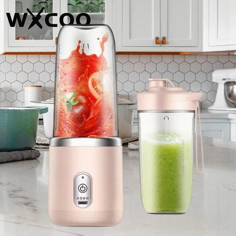 Portable electric blender in light pink, featuring a clear cup and a sleek, compact modern design for juices.