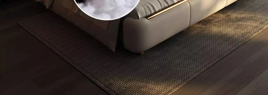 Modern, double-sized beige bed frame featuring a sleek, padded design with metallic gold trim details.