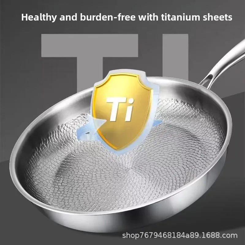 Stainless steel frying pan with a textured, hammered interior and a gold shield with "Ti" in the center.