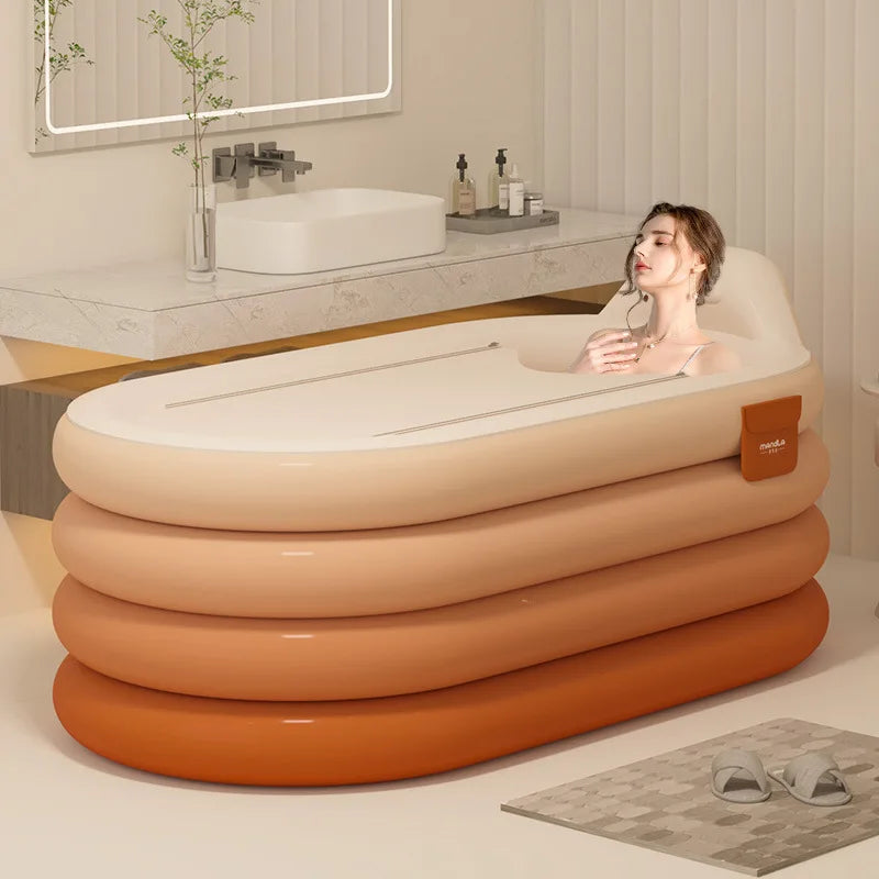 A woman relaxes in an inflatable bathtub with stacked orange and cream tiers in a modern bathroom.