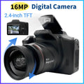 Black plastic 16MP digital camera with a 2.4-inch TFT screen, pop-up flash, and lens adjustment indicator.