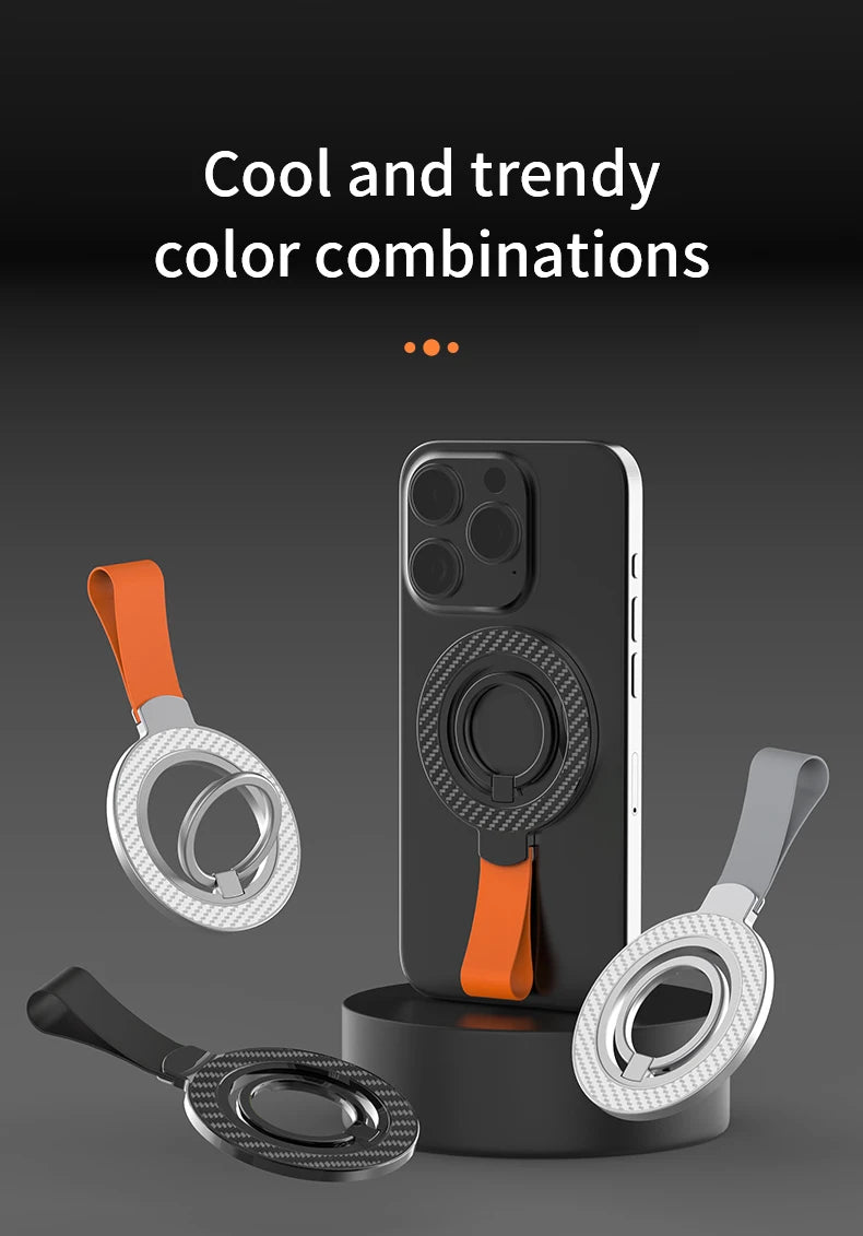 Magnetic phone ring holders with straps in black, silver, and orange, displayed against a dark background.