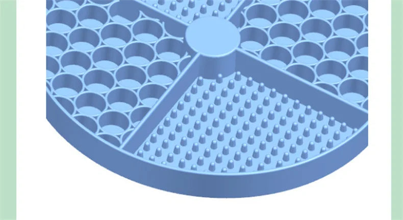 Light blue, circular plastic tray divided into quadrants with textured circle and small peg patterns.