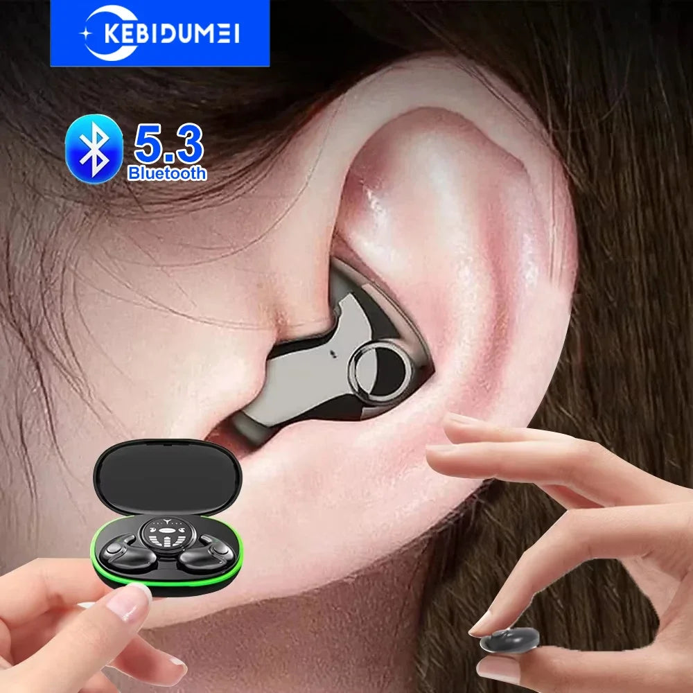 Glossy black wireless earbud worn in the ear, with a matching black charging case featuring a green accent light.
