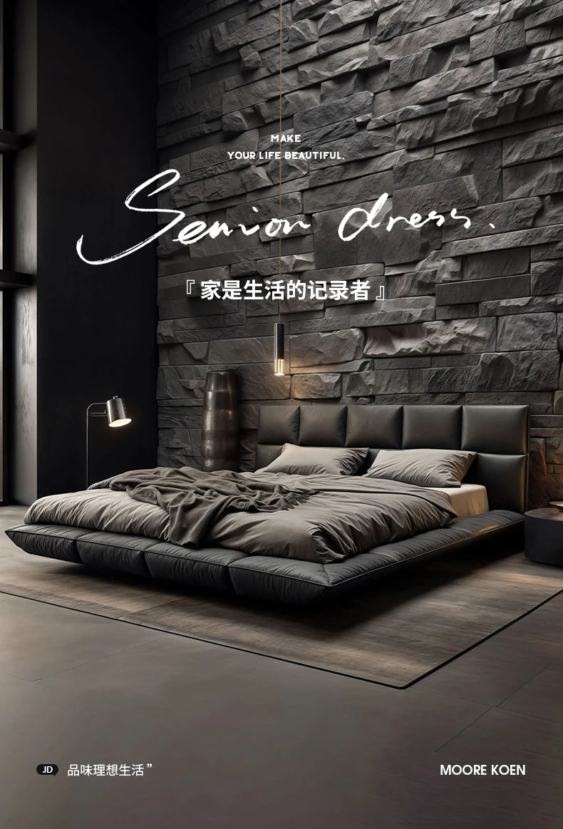 Modern, low-profile black leather king-size floating bed with a tufted headboard, set against a dark stone wall.