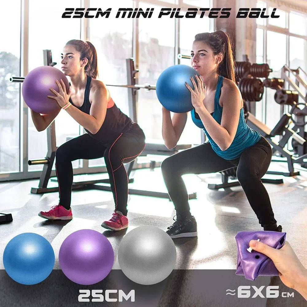 Two women in a gym holding blue and purple 25cm mini Pilates balls, with blue, purple, and silver options shown.