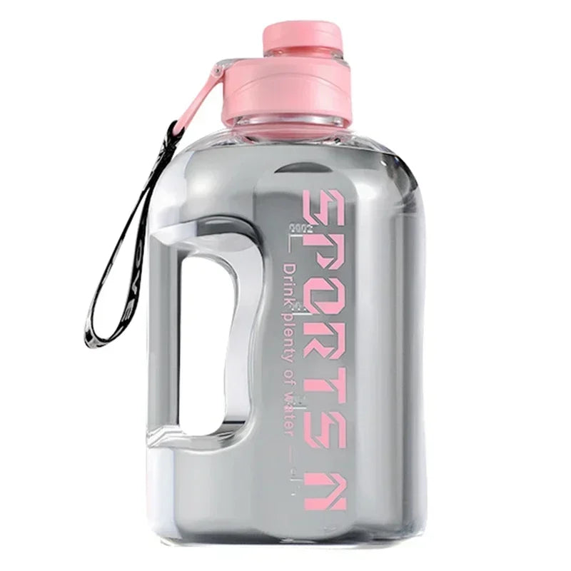 Clear plastic sports water bottle with a pink lid, integrated handle, and pink "SPORTS" text and carry strap.