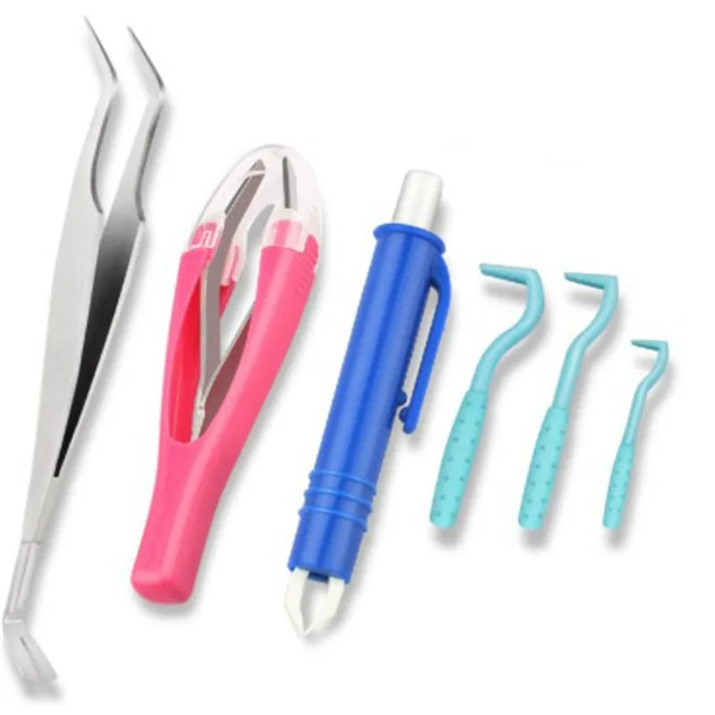 A set of tick removal tools including silver tweezers, a pink tool, a blue pen-style remover, and three blue picks.